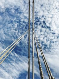 Low angle view of crane against blue sky