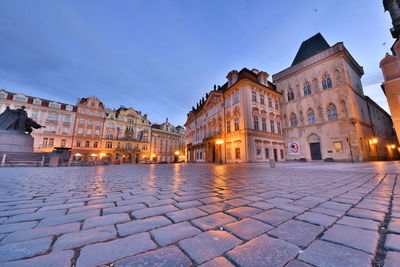 View of buildings in town at night