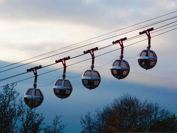 Signtseeing gondola passing over the hill