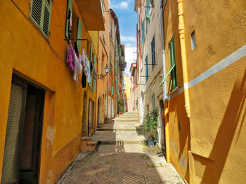 Narrow alley amidst buildings in town