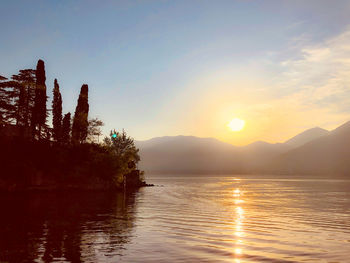 Scenic view of lake against sky during sunset