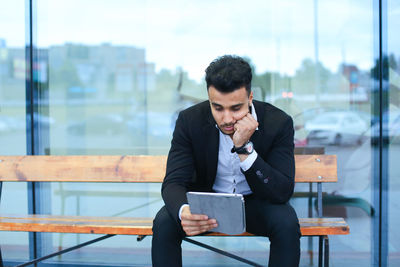 Young man using mobile phone