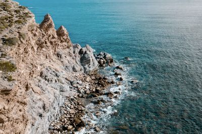 High angle view of rocks on shore