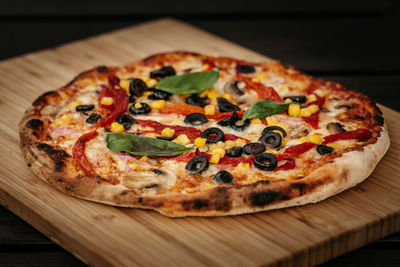 Close-up of pizza on cutting board