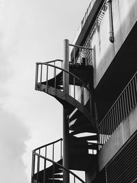 Low angle view of elevated walkway against sky