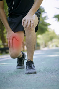 Low section of man legs on street