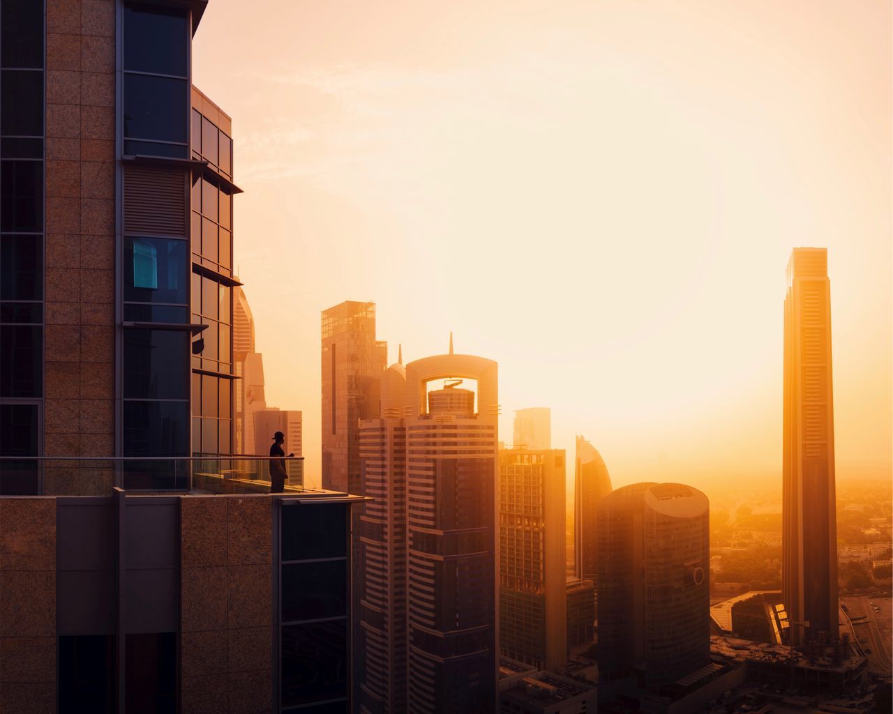 building exterior, built structure, sky, architecture, city, office building exterior, building, sunset, skyscraper, office, modern, cityscape, no people, nature, sunlight, tall - high, tower, sun, urban skyline, landscape, outdoors, lens flare, financial district