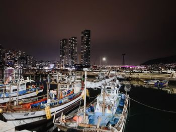Boats moored at harbor