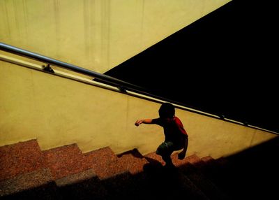 Boy walking up stairs