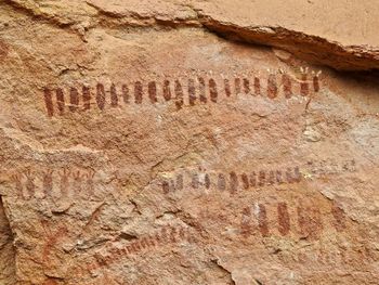 Close-up of text on rock