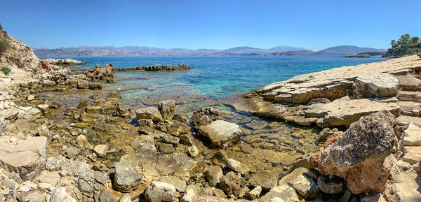 Scenic view of sea against clear blue sky