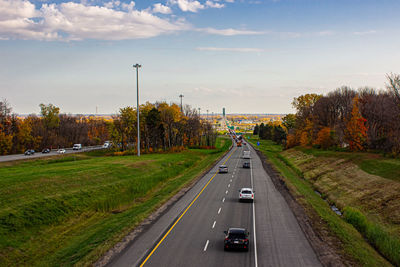 Road amidst plants against sky