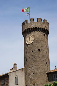 Low angle view of clock tower against sky