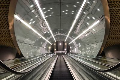 Low angle view of illuminated subway station