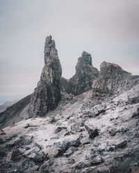 Rock formations on mountain against sky