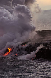 Scenic view of sea against dramatic sky