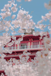 Low angle view of building against cloudy sky