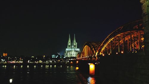 Bridge over river at night