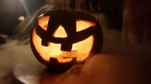 Close-up of illuminated pumpkin at home