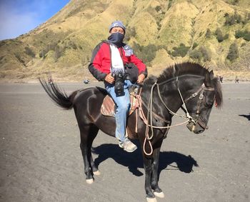 Man riding horse