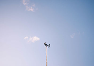 Low angle view of street light against sky