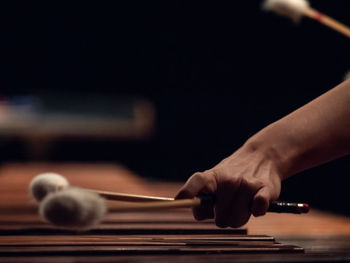 Close-up of hand playing guitar