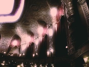 Low angle view of illuminated lights at night