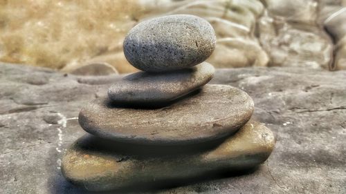 Close-up of stone stack on rock