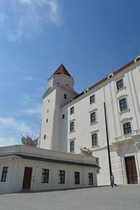 Low angle view of building against blue sky