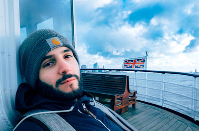 Portrait of man in hat against sky