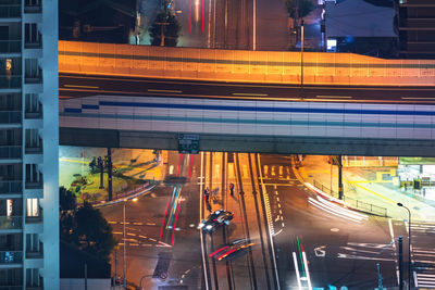 High angle view of light trails on road at night