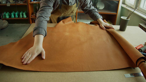 Low section of man on table