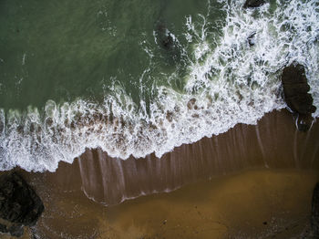 Drone view of sea waves at beach