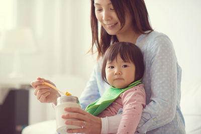 Portrait of mother holding baby