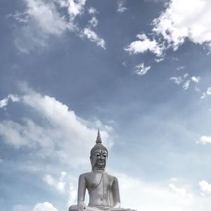 Low angle view of statue against sky