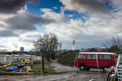 Cars on road against sky