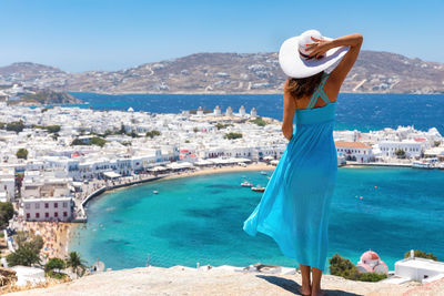 Woman standing on shore in greece