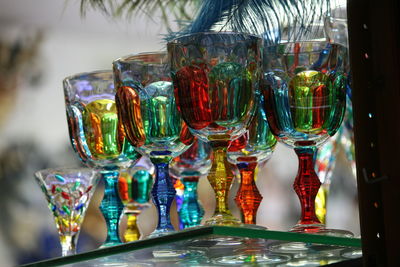 Close-up of wine glasses on table