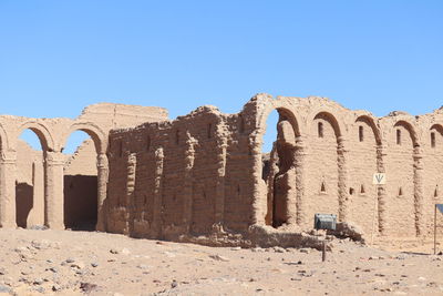 Old ruin building against blue sky