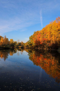 Scenic view of lake against sky during autumn