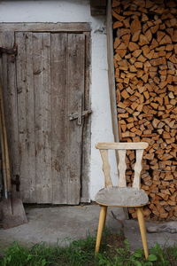 Stack of old wooden table against wall