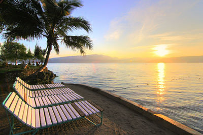 Scenic view of beach against sky during sunset