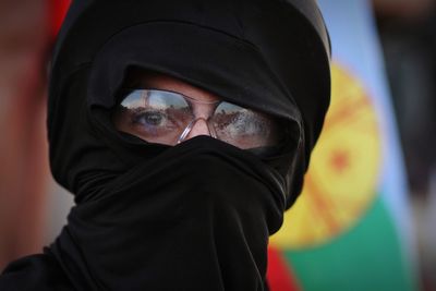 Close-up portrait of man covering face