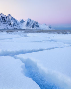 Beautiful calm cold morning on the lototen at haukland, with beautiful soft pink colors in the sky. 