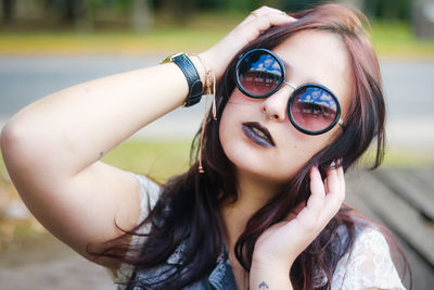 Portrait of young woman wearing sunglasses