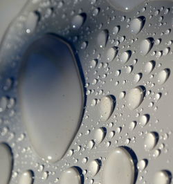 Close-up of raindrops on glass window