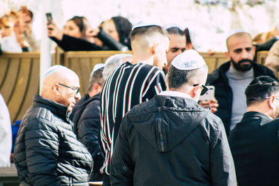 People standing on street in city