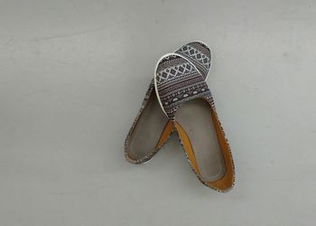 High angle view of shoes on floor against white background