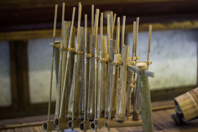 Close-up of piano hanging in temple