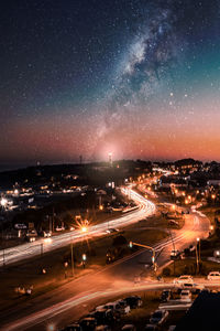 High angle view of illuminated buildings against sky at night, after the beach and lighthose